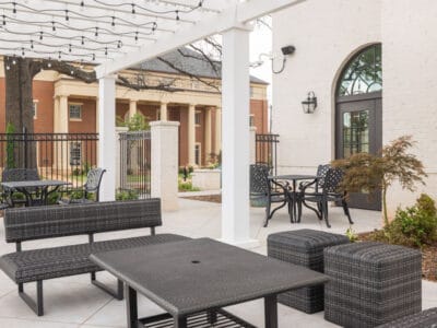 Outdoor patio with seating and landscaping at newly constructed sorority house