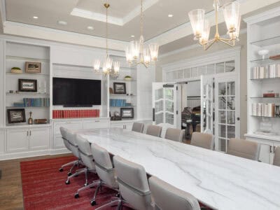 Study room with large white marble table and built-in bookshelves for studying or chapter meetings